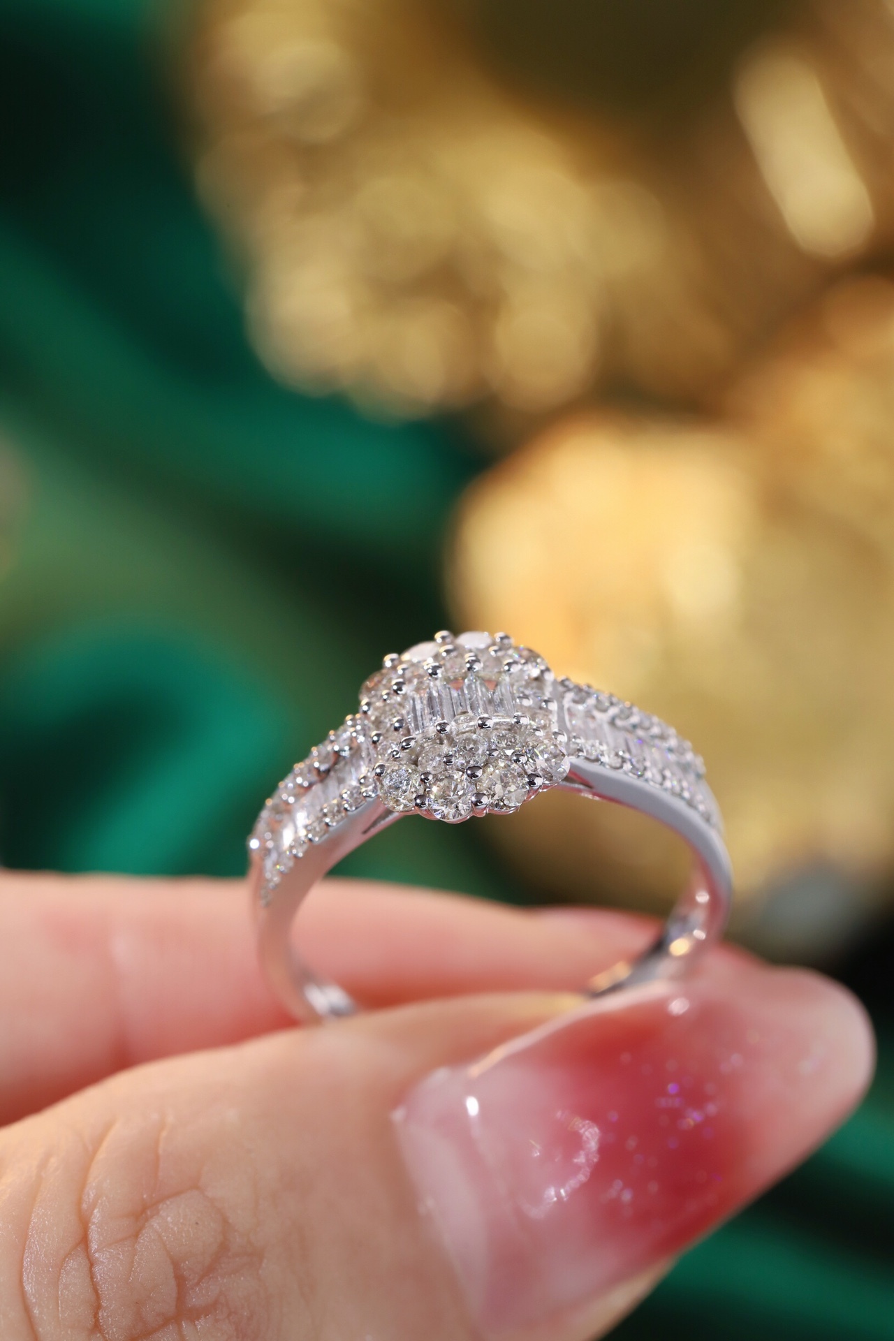 18k gold ring set with a natural diamond; the diamond features a Tapered Baguette cut and weighs 1.00 carats.