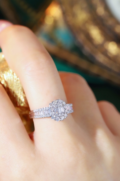 18k gold ring set with a natural diamond; the diamond features a Tapered Baguette cut and weighs 1.00 carats.