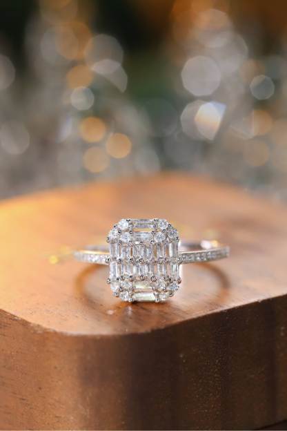 18k gold ring set with a natural diamond; the diamond features a Tapered Baguette cut and weighs 0.50 carats.