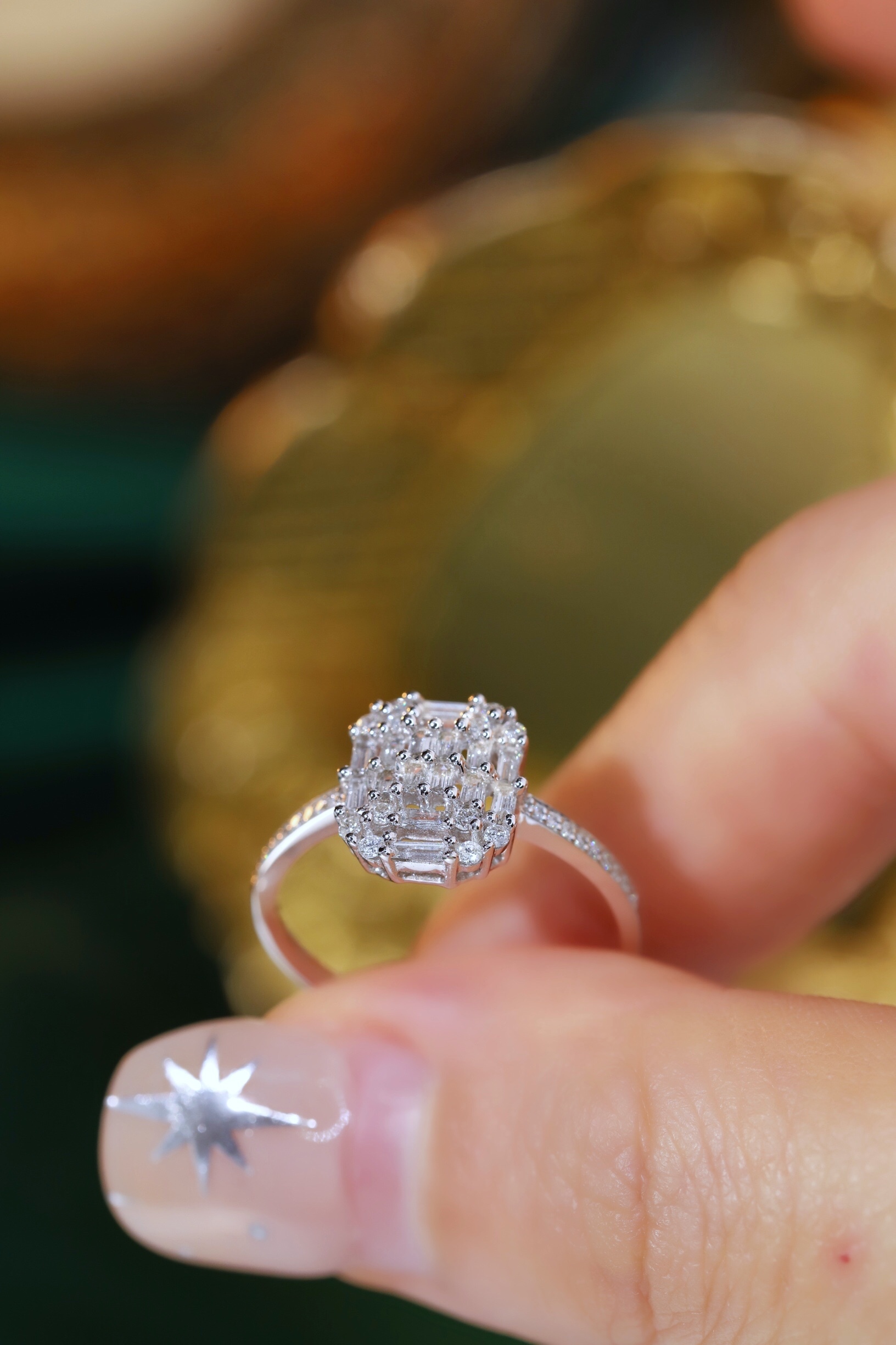 18k gold ring set with a natural diamond; the diamond features a Tapered Baguette cut and weighs 0.50 carats.