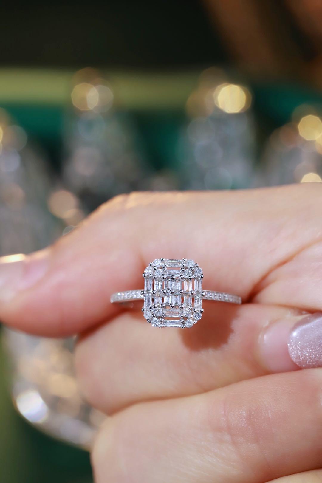 18k gold ring set with a natural diamond; the diamond features a Tapered Baguette cut and weighs 0.50 carats.