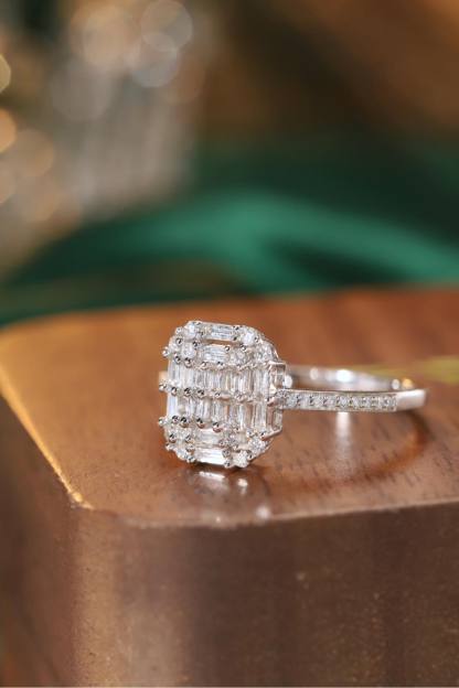 18k gold ring set with a natural diamond; the diamond features a Tapered Baguette cut and weighs 0.50 carats.