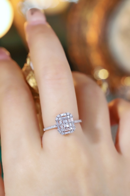 18k gold ring set with a natural diamond; the diamond features a Tapered Baguette cut and weighs 0.50 carats.