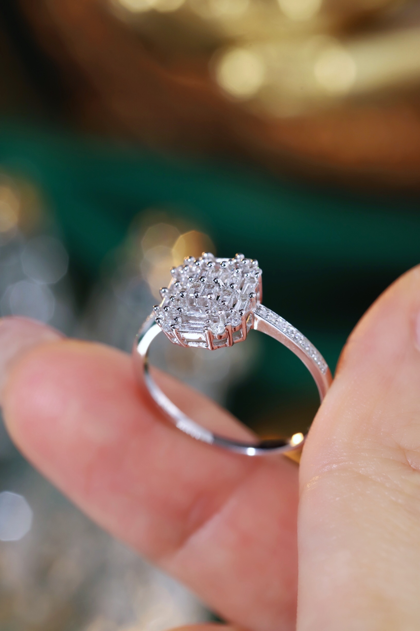 18k gold ring set with a natural diamond; the diamond features a Tapered Baguette cut and weighs 0.50 carats.