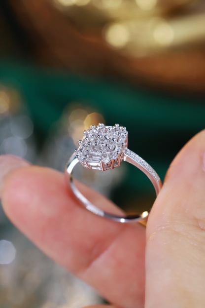 18k gold ring set with a natural diamond; the diamond features a Tapered Baguette cut and weighs 0.50 carats.