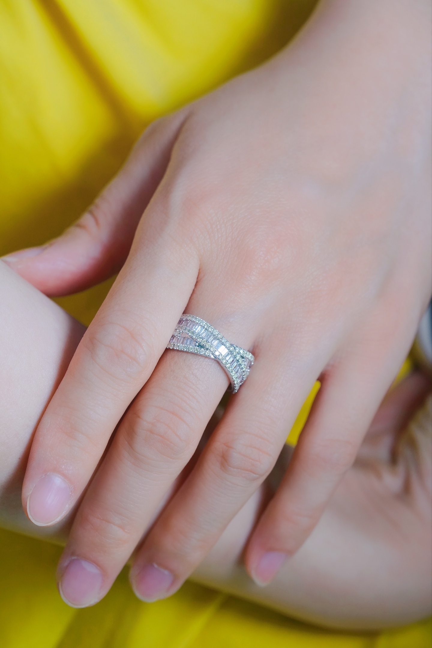 18k gold ring set with a natural diamond; the diamond features a Tapered Baguette cut and weighs 1.00 carats.