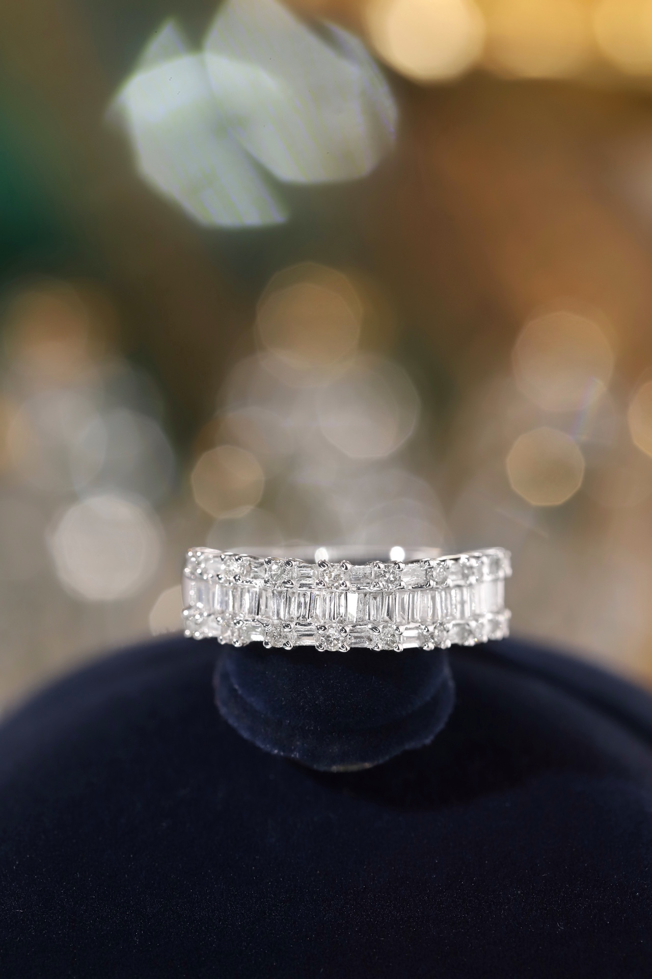 18k gold ring set with a natural diamond; the diamond features a Tapered Baguette cut and weighs 0.55 carats.