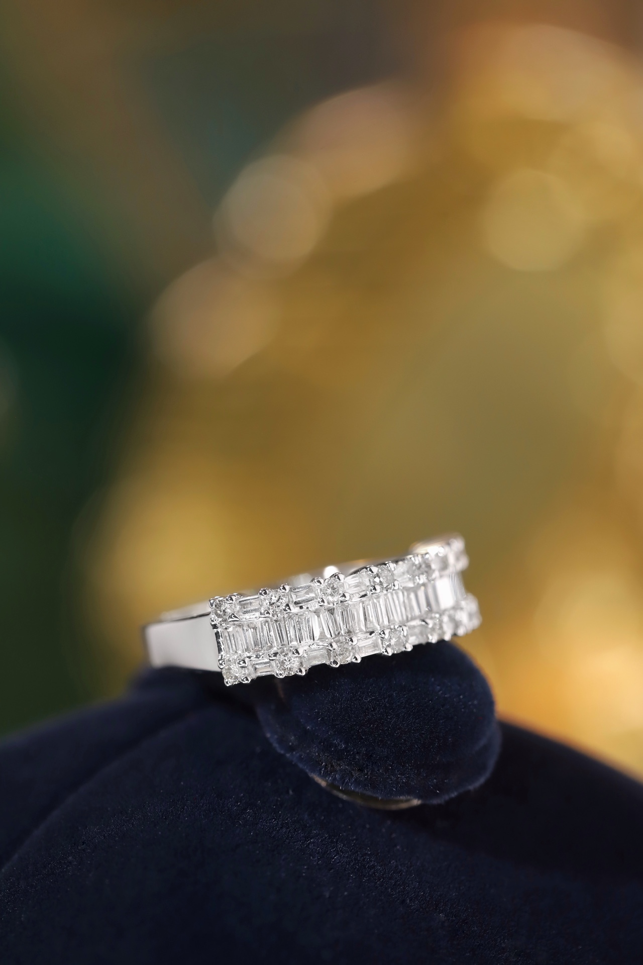 18k gold ring set with a natural diamond; the diamond features a Tapered Baguette cut and weighs 0.55 carats.
