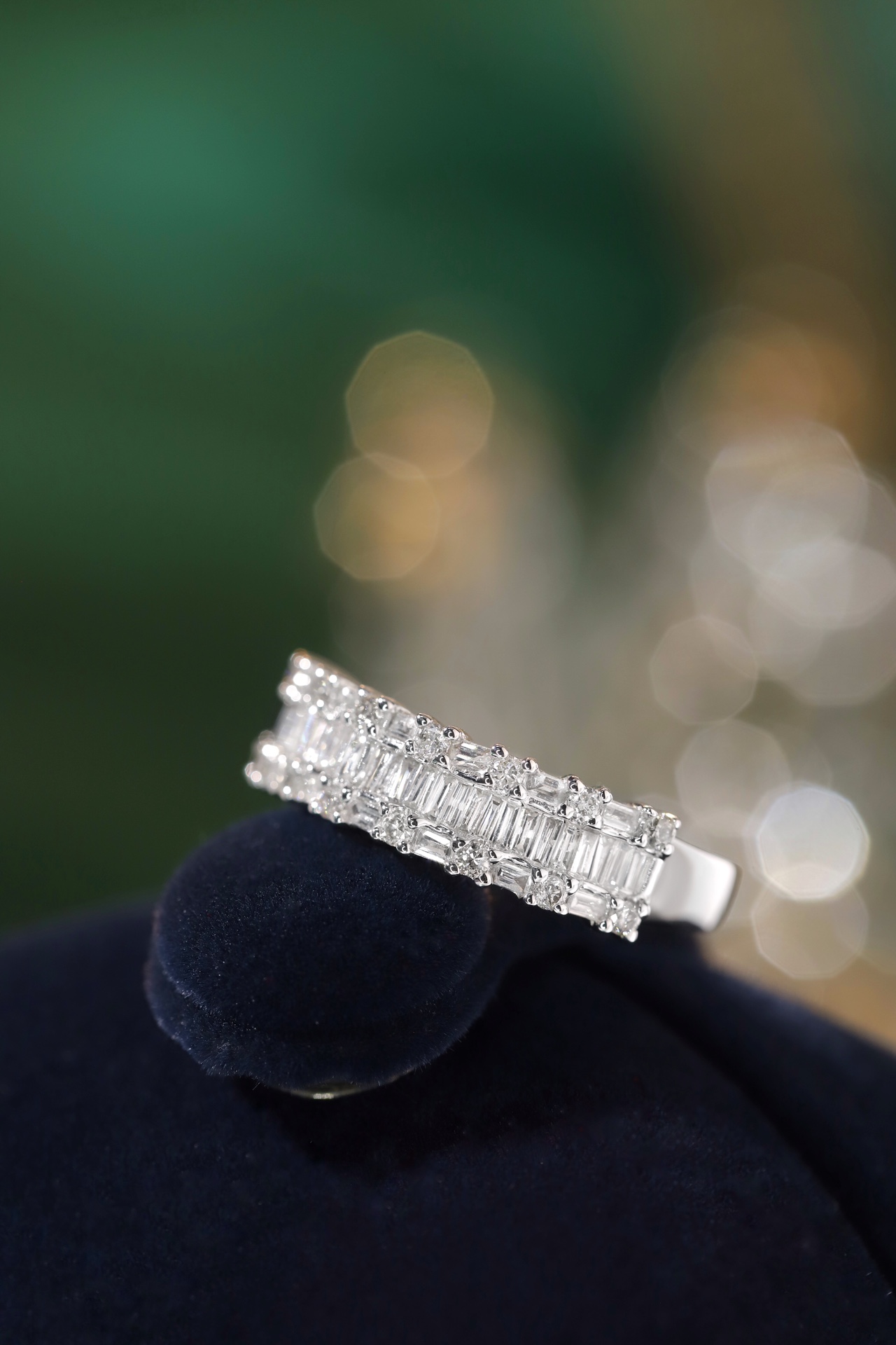 18k gold ring set with a natural diamond; the diamond features a Tapered Baguette cut and weighs 0.55 carats.