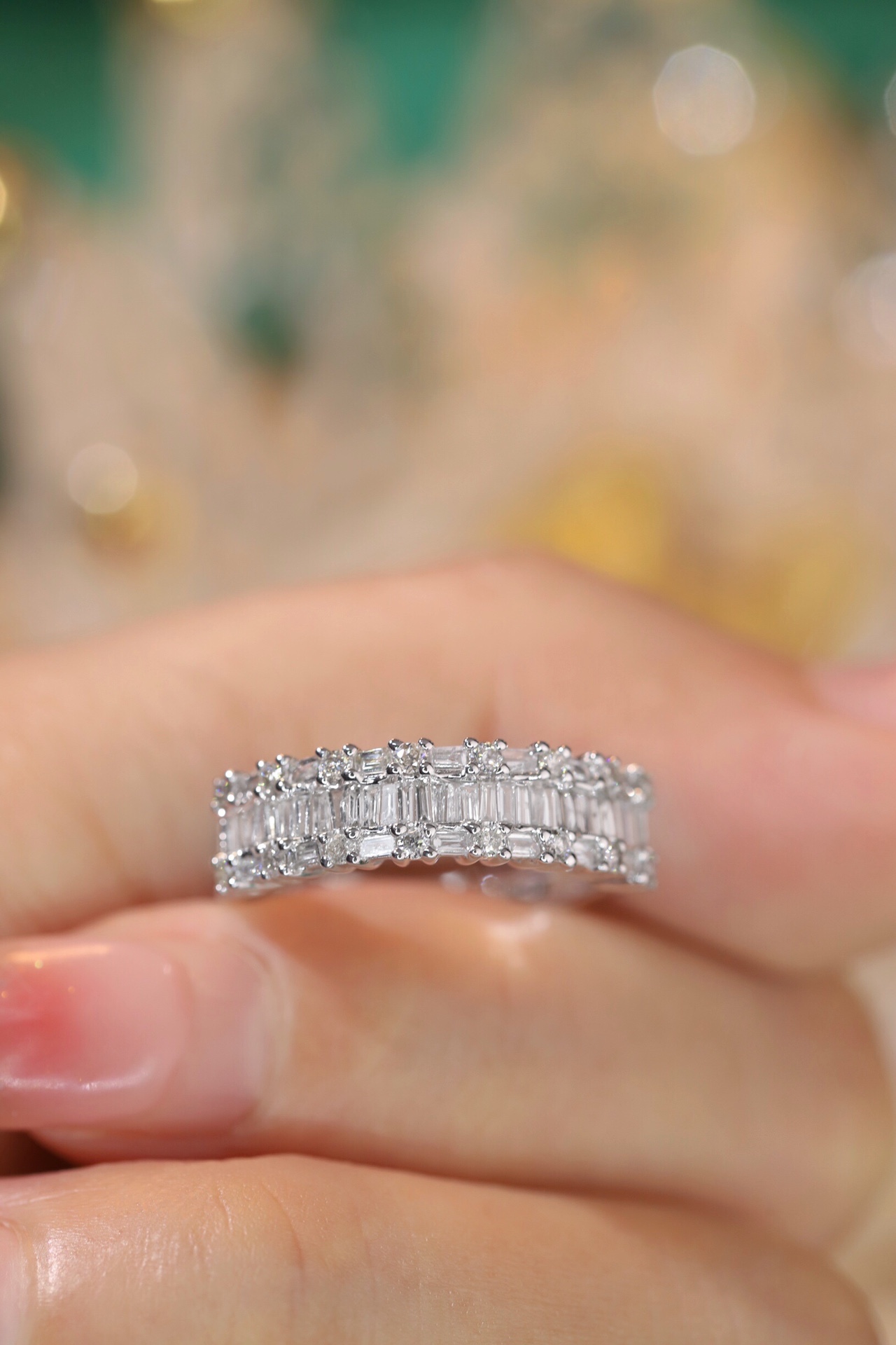 18k gold ring set with a natural diamond; the diamond features a Tapered Baguette cut and weighs 0.55 carats.