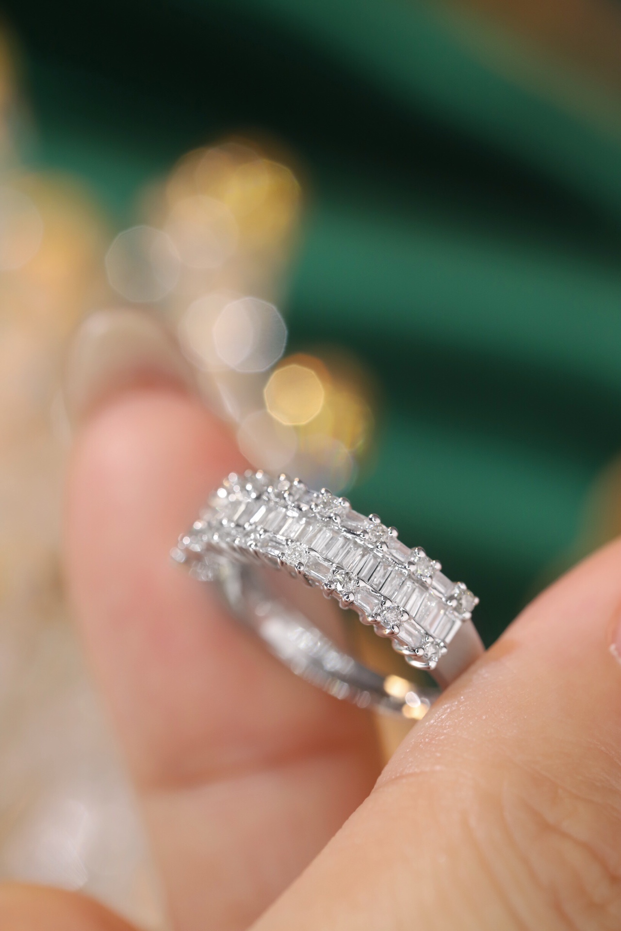 18k gold ring set with a natural diamond; the diamond features a Tapered Baguette cut and weighs 0.55 carats.