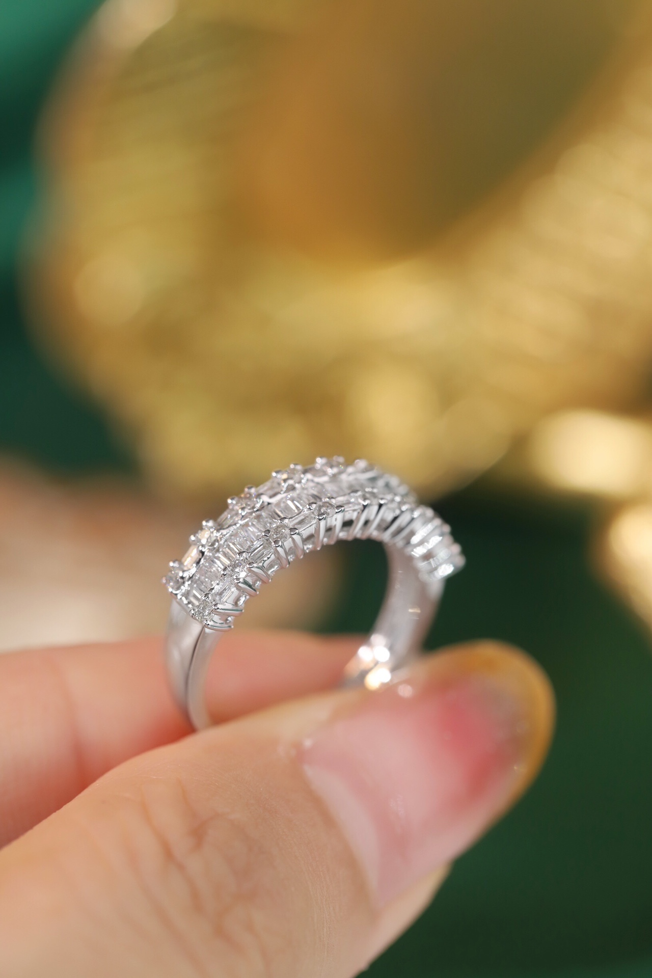 18k gold ring set with a natural diamond; the diamond features a Tapered Baguette cut and weighs 0.55 carats.