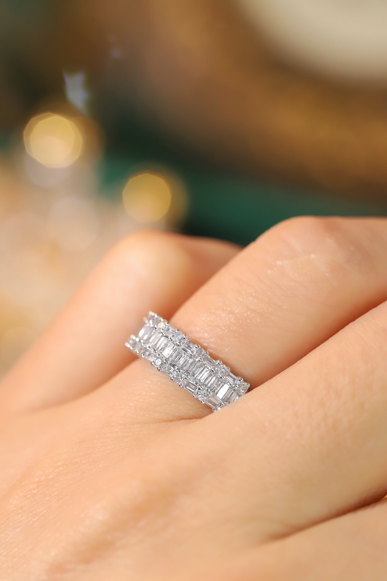 18k gold ring set with a natural diamond; the diamond features a Tapered Baguette cut and weighs 0.55 carats.