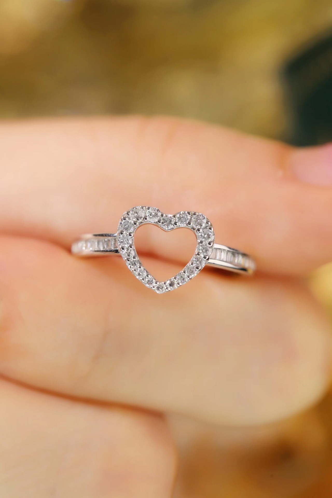 18k gold ring set with a natural diamond; the diamond features a Tapered Baguette cut and weighs 0.30 carats.