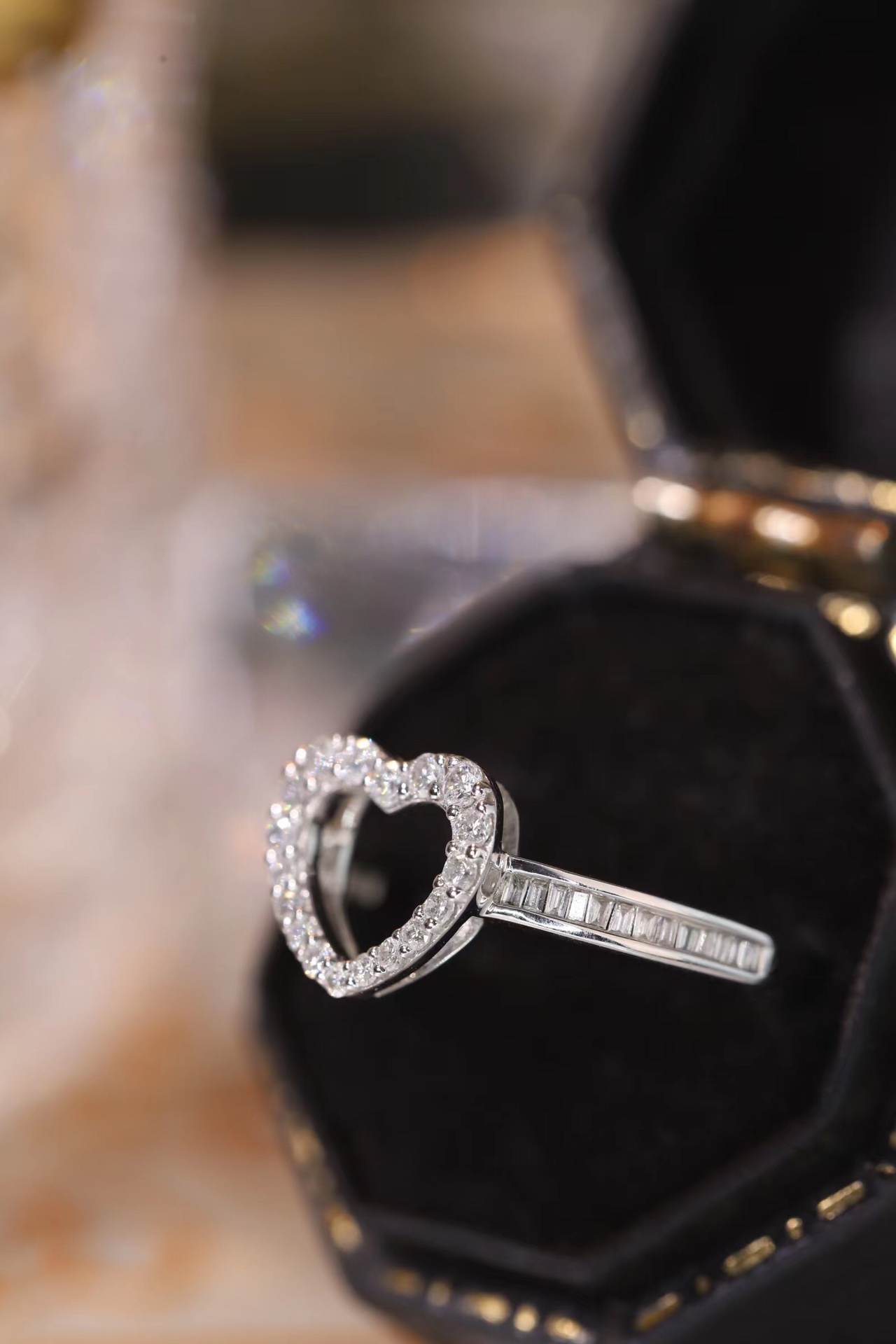 18k gold ring set with a natural diamond; the diamond features a Tapered Baguette cut and weighs 0.30 carats.