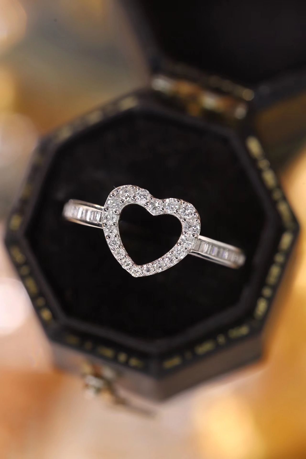 18k gold ring set with a natural diamond; the diamond features a Tapered Baguette cut and weighs 0.30 carats.