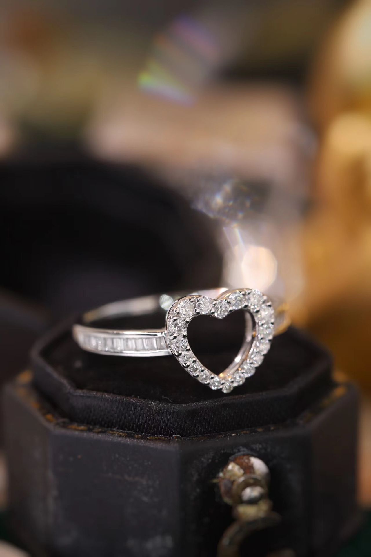 18k gold ring set with a natural diamond; the diamond features a Tapered Baguette cut and weighs 0.30 carats.