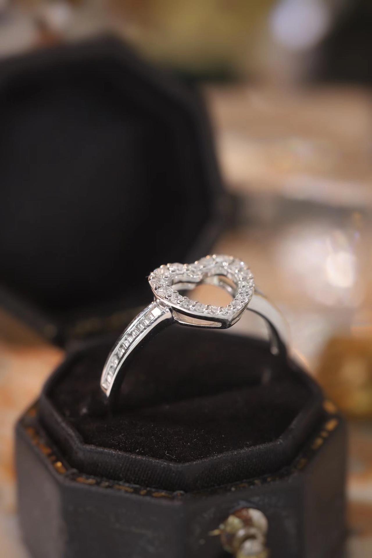 18k gold ring set with a natural diamond; the diamond features a Tapered Baguette cut and weighs 0.30 carats.
