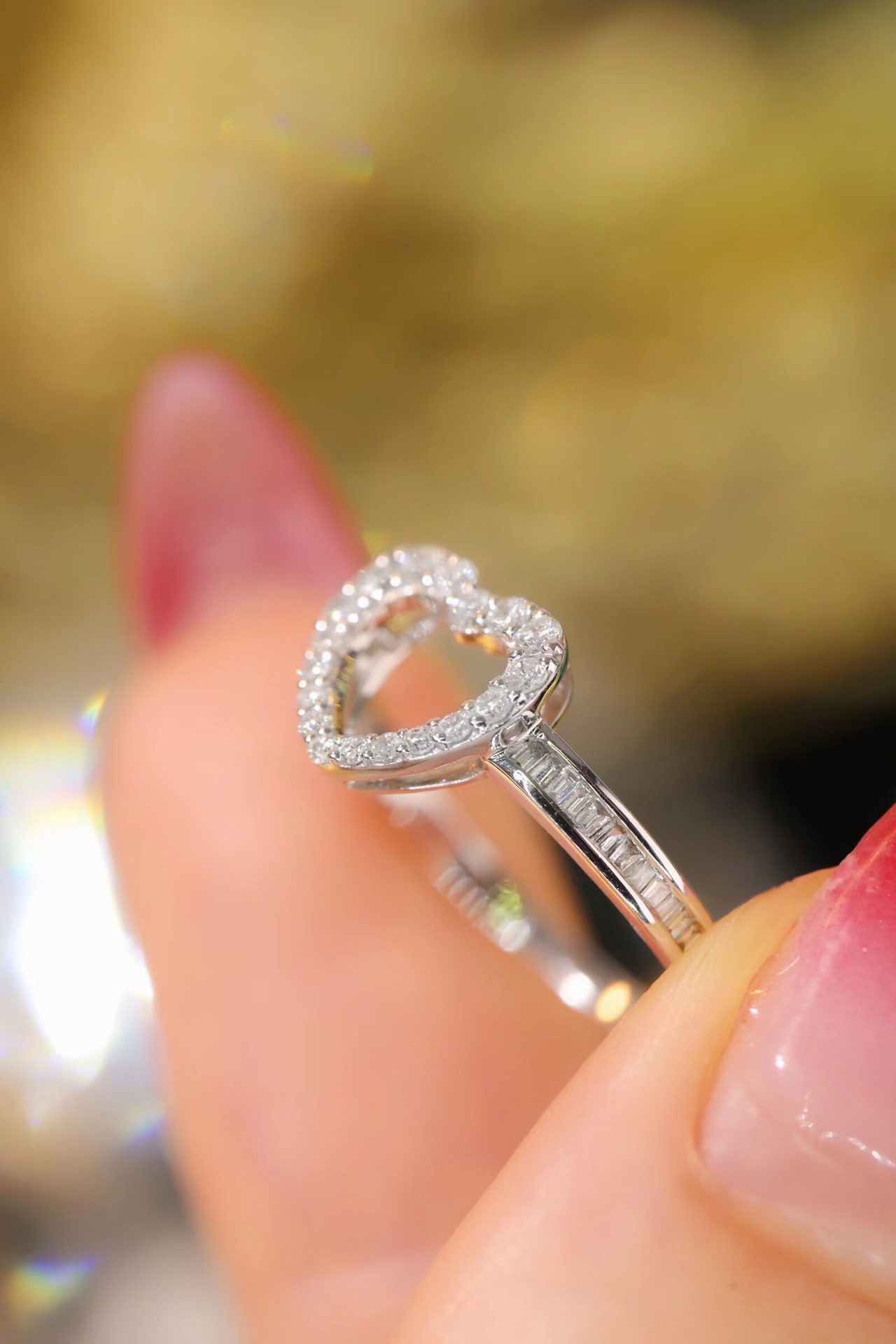 18k gold ring set with a natural diamond; the diamond features a Tapered Baguette cut and weighs 0.30 carats.