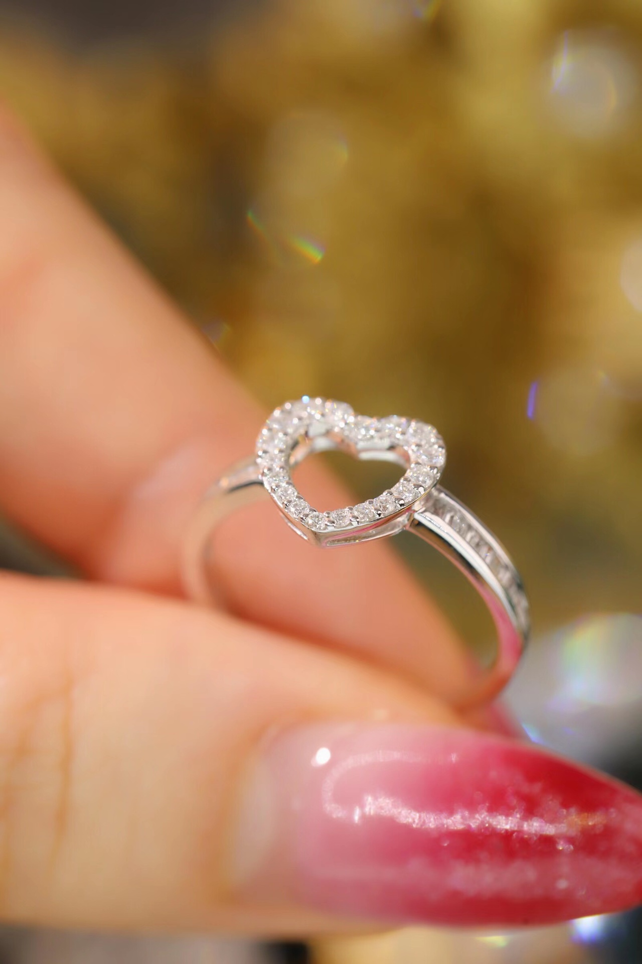 18k gold ring set with a natural diamond; the diamond features a Tapered Baguette cut and weighs 0.30 carats.