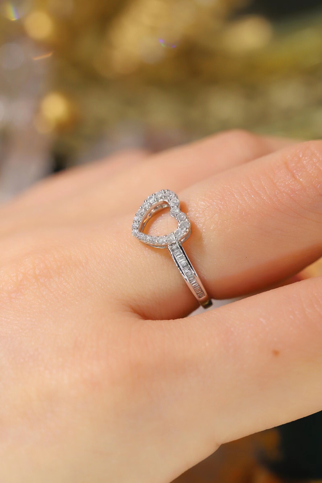 18k gold ring set with a natural diamond; the diamond features a Tapered Baguette cut and weighs 0.30 carats.