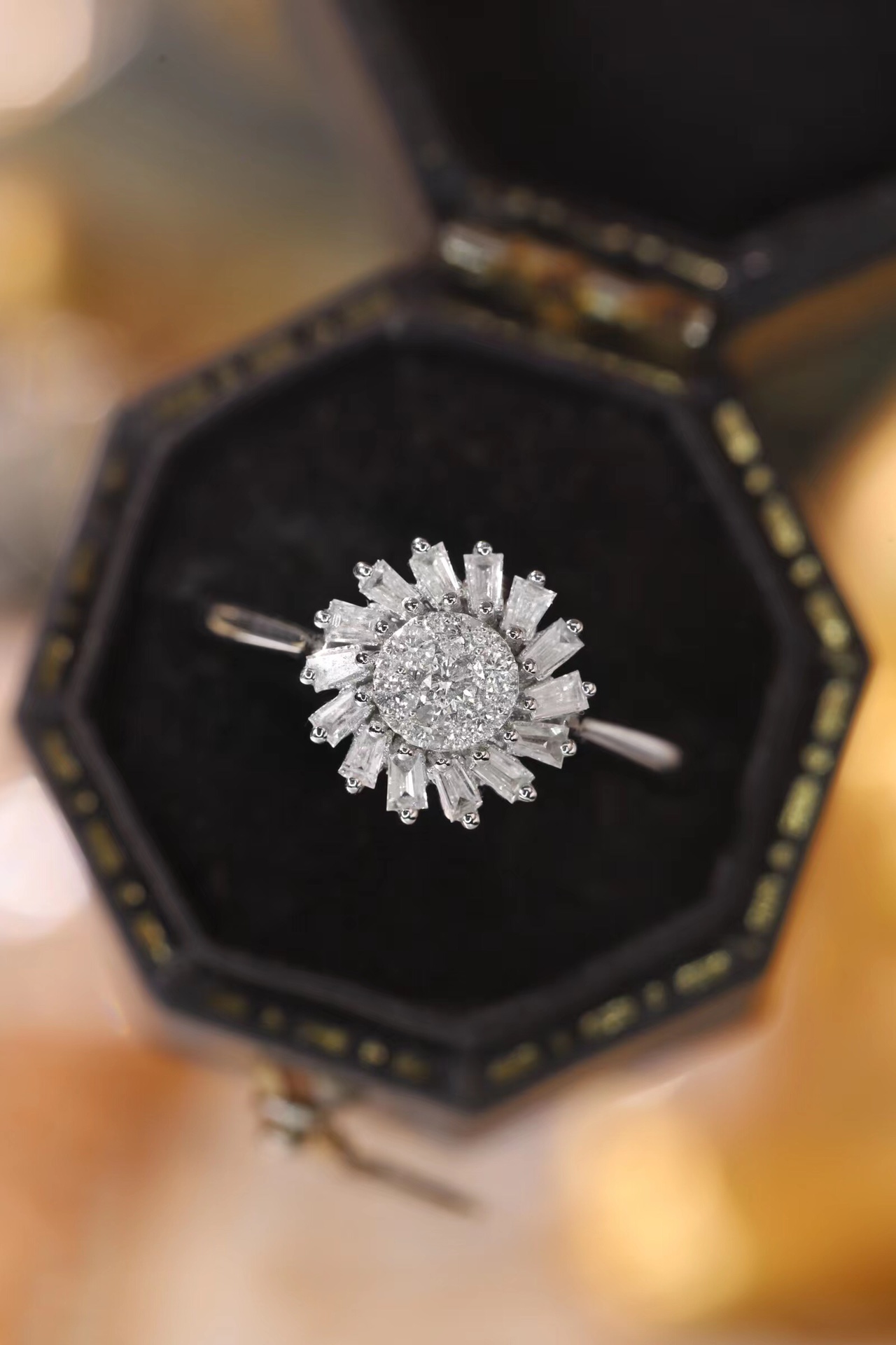 18k gold ring set with a natural diamond; the diamond features a Tapered Baguette cut and weighs 0.40 carats.