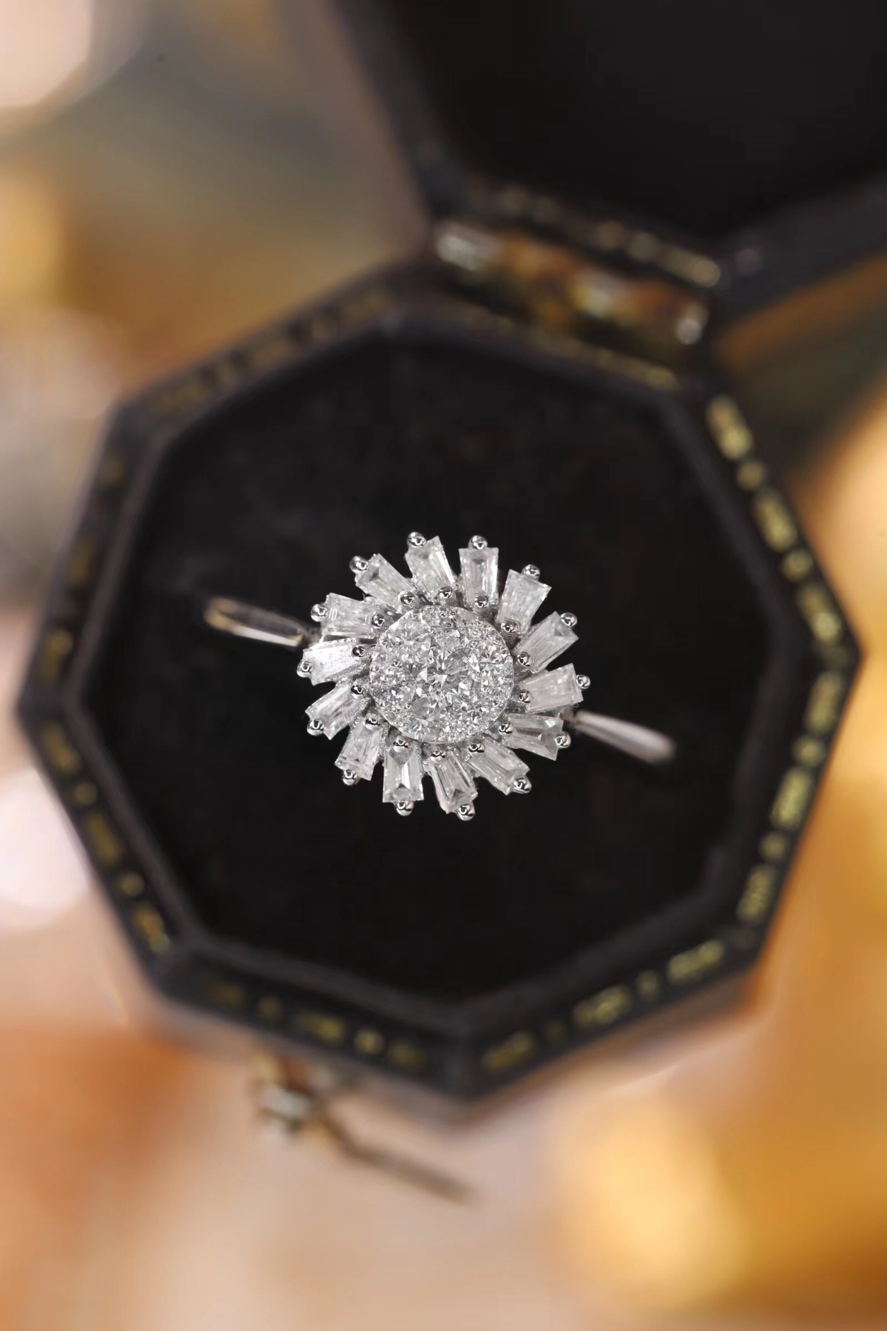 18k gold ring set with a natural diamond; the diamond features a Tapered Baguette cut and weighs 0.40 carats.