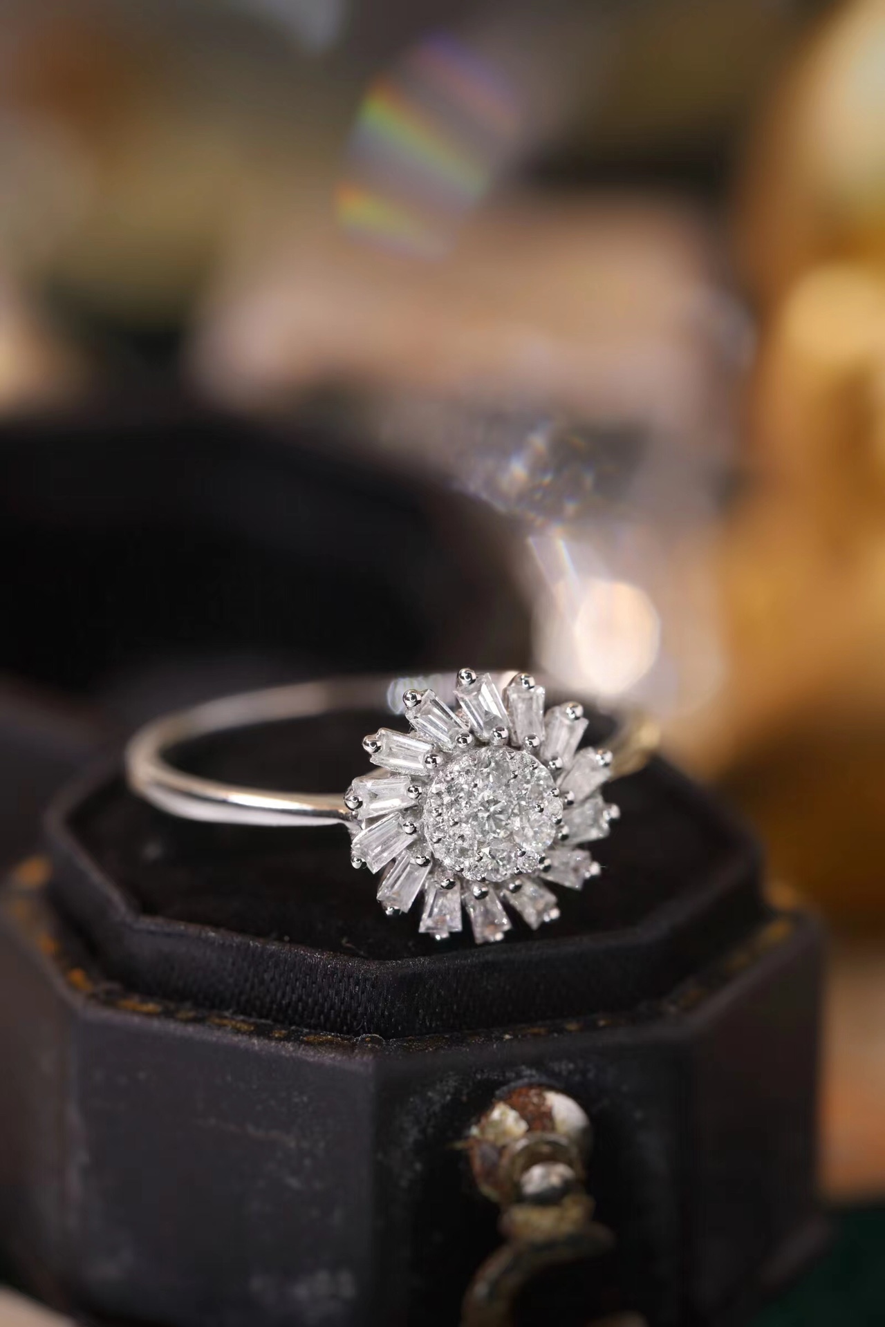 18k gold ring set with a natural diamond; the diamond features a Tapered Baguette cut and weighs 0.40 carats.