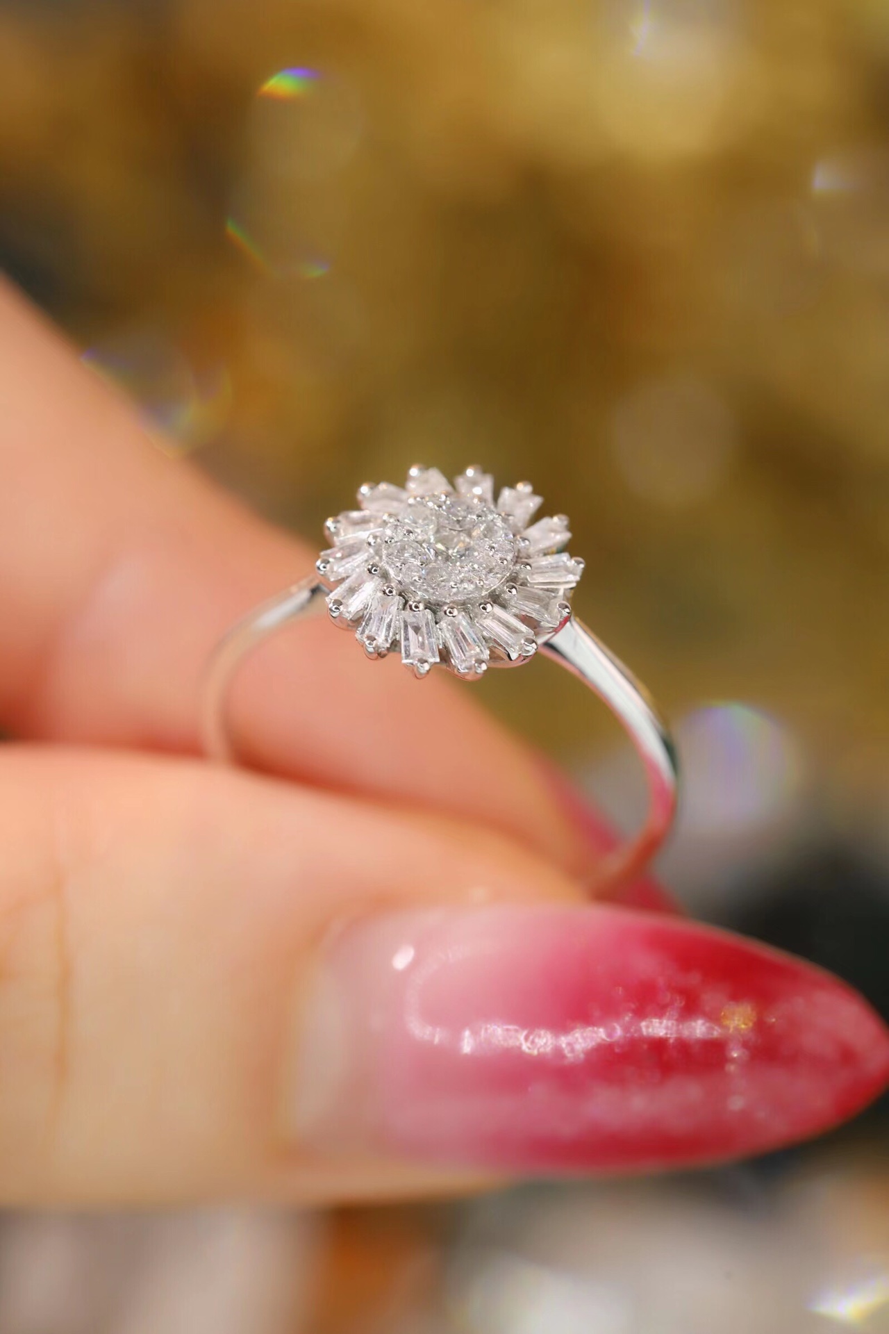 18k gold ring set with a natural diamond; the diamond features a Tapered Baguette cut and weighs 0.40 carats.