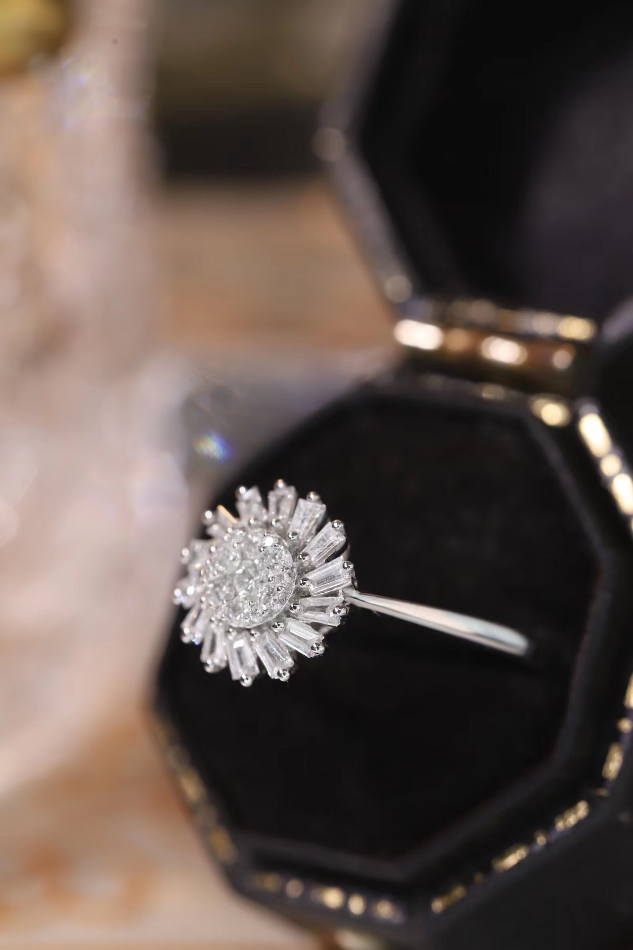 18k gold ring set with a natural diamond; the diamond features a Tapered Baguette cut and weighs 0.40 carats.