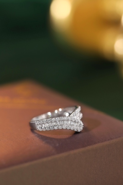 18k gold ring set with a natural diamond; the diamond features a Tapered Baguette cut and weighs 0.50 carats.