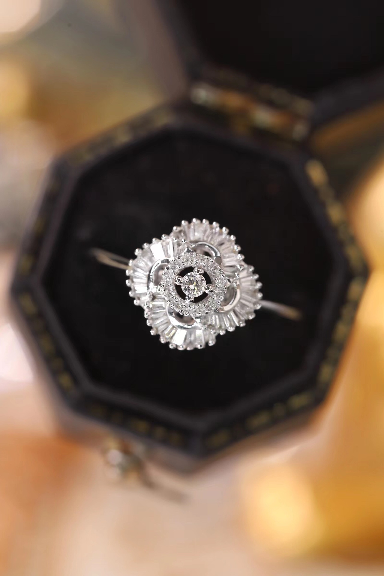 18k gold ring set with a natural diamond; the diamond features a Tapered Baguette cut and weighs 0.25carats.