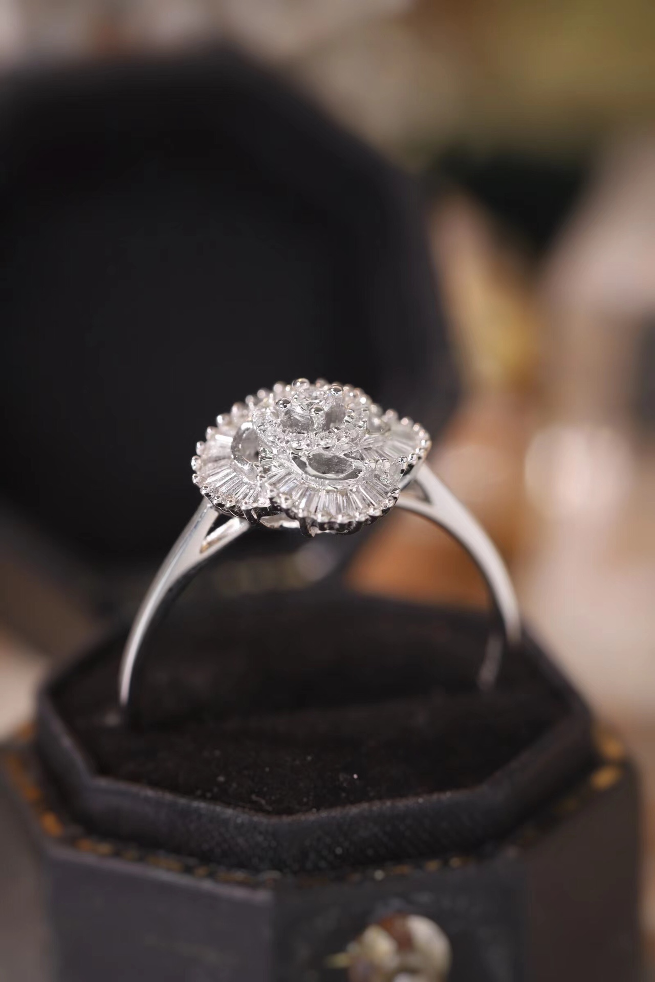 18k gold ring set with a natural diamond; the diamond features a Tapered Baguette cut and weighs 0.25carats.