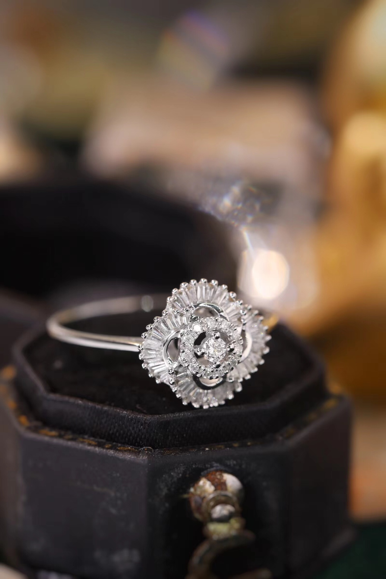 18k gold ring set with a natural diamond; the diamond features a Tapered Baguette cut and weighs 0.25carats.