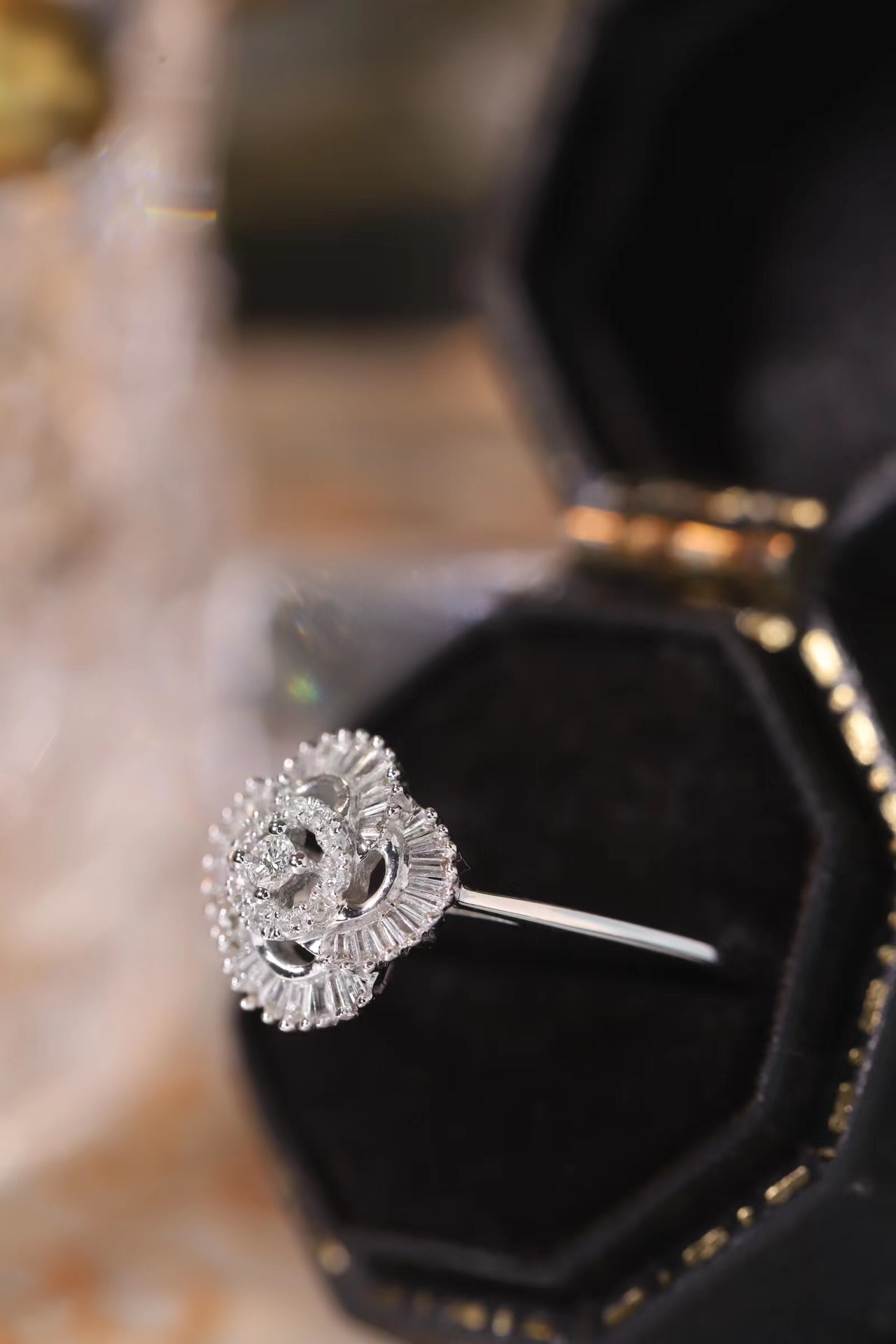 18k gold ring set with a natural diamond; the diamond features a Tapered Baguette cut and weighs 0.25carats.