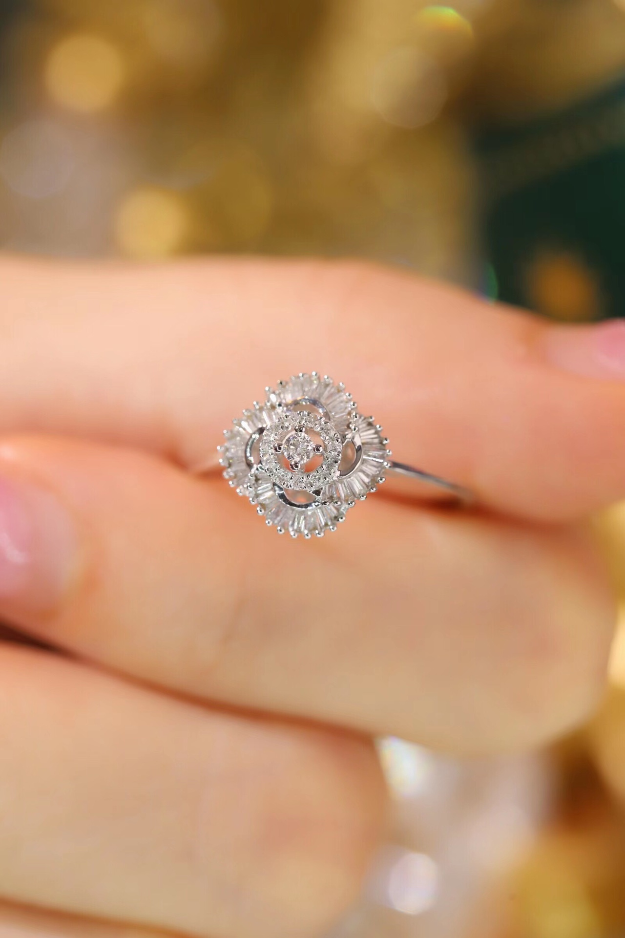 18k gold ring set with a natural diamond; the diamond features a Tapered Baguette cut and weighs 0.25carats.