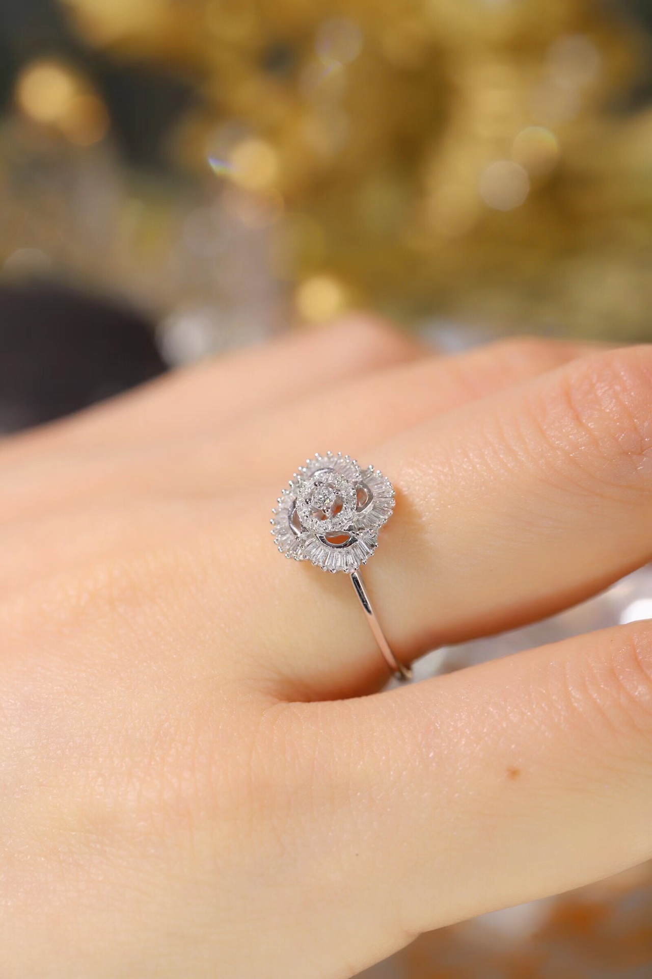 18k gold ring set with a natural diamond; the diamond features a Tapered Baguette cut and weighs 0.25carats.