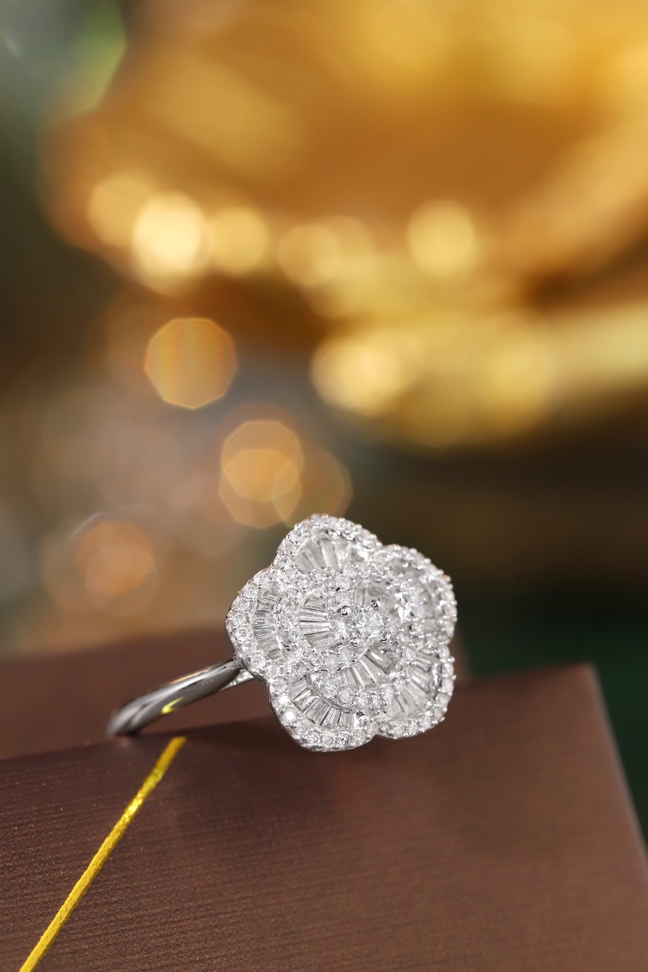 18k gold ring set with a natural diamond; the diamond features a Tapered Baguette cut and weighs 0.50carats.