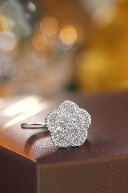 18k gold ring set with a natural diamond; the diamond features a Tapered Baguette cut and weighs 0.50carats.