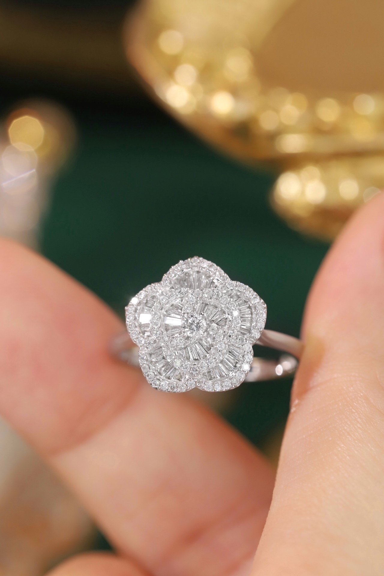 18k gold ring set with a natural diamond; the diamond features a Tapered Baguette cut and weighs 0.50carats.