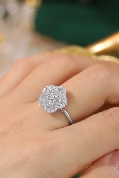 18k gold ring set with a natural diamond; the diamond features a Tapered Baguette cut and weighs 0.50carats.