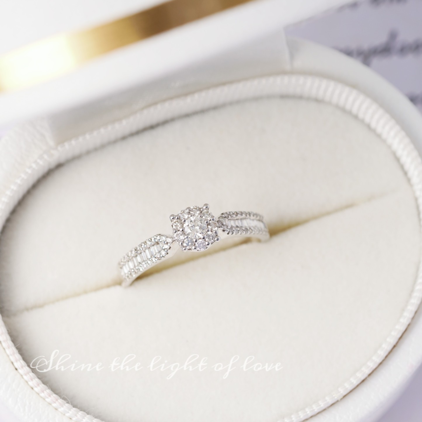 18k gold ring set with a natural diamond; the diamond features a Tapered Baguette cut and weighs 0.47carats.