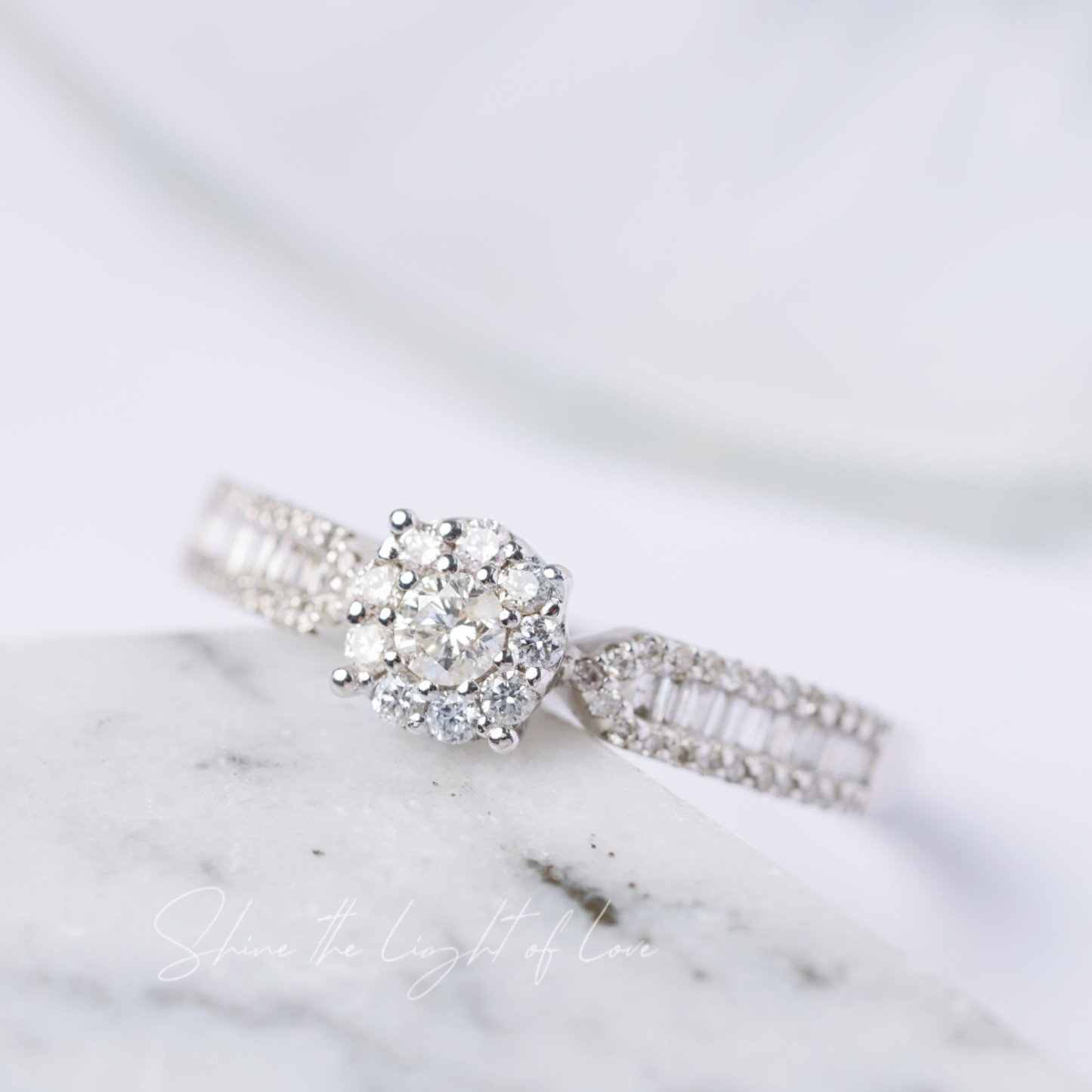 18k gold ring set with a natural diamond; the diamond features a Tapered Baguette cut and weighs 0.47carats.