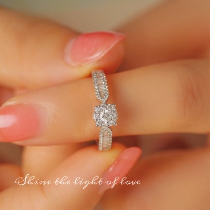 18k gold ring set with a natural diamond; the diamond features a Tapered Baguette cut and weighs 0.47carats.