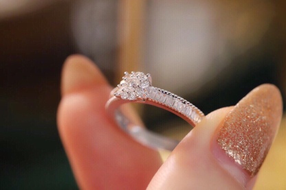 18k gold ring set with a natural diamond; the diamond features a Tapered Baguette cut and weighs 0.40carats.