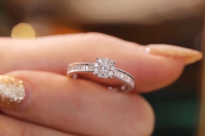 18k gold ring set with a natural diamond; the diamond features a Tapered Baguette cut and weighs 0.40carats.