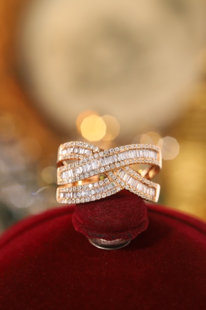18k gold ring set with a natural diamond; the diamond features a Tapered Baguette cut and weighs 0.75carats.