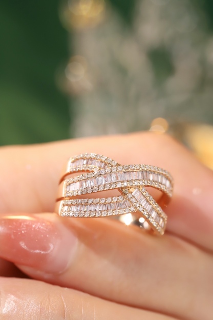 18k gold ring set with a natural diamond; the diamond features a Tapered Baguette cut and weighs 0.75carats.