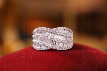 18k gold ring set with a natural diamond; the diamond features a Tapered Baguette cut and weighs 1.10carats.