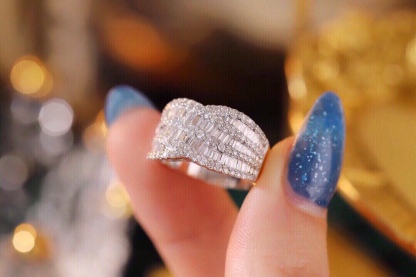 18k gold ring set with a natural diamond; the diamond features a Tapered Baguette cut and weighs 1.10carats.